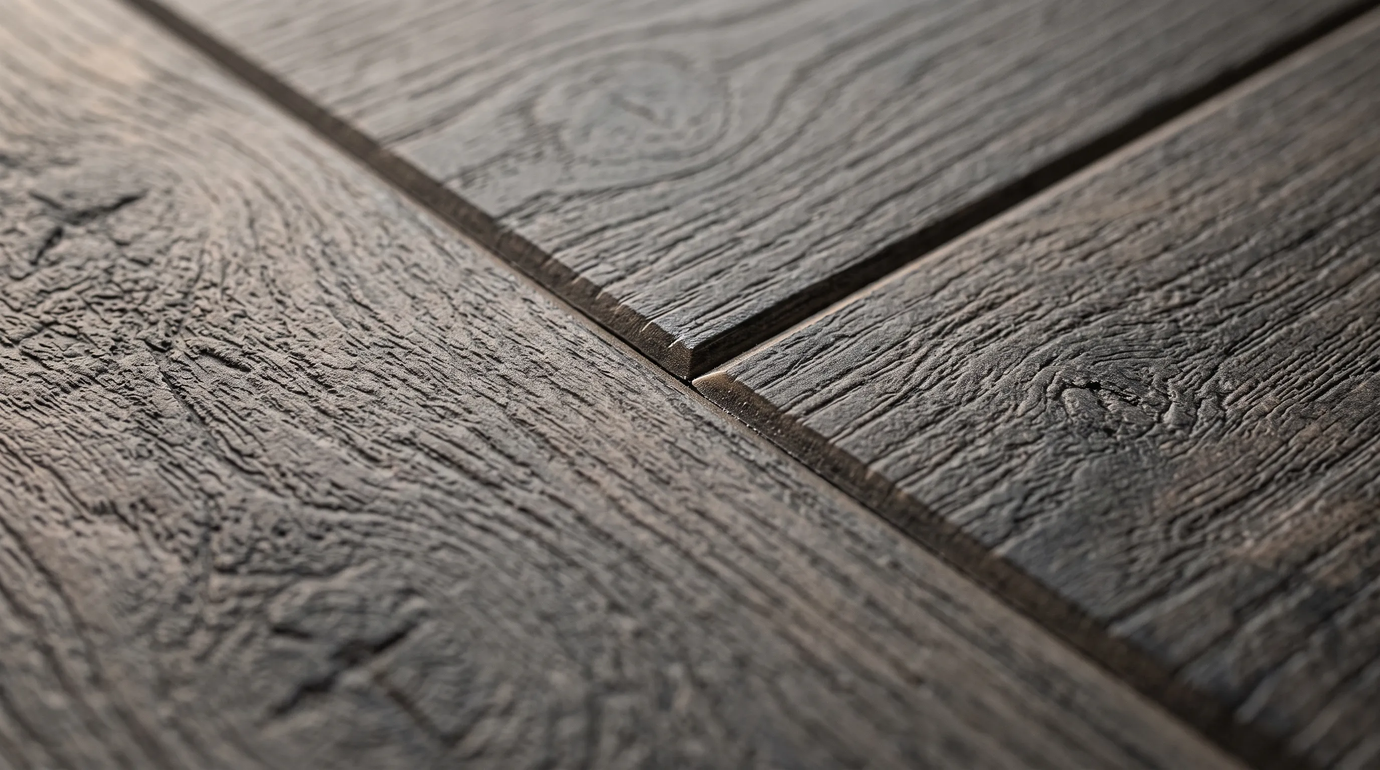 Macro photograph of luxury vinyl plank flooring showing embossed grain and a bevelled plank edge